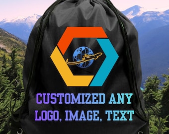 May include: A black drawstring backpack featuring a central graphic of a blue globe with an airplane silhouette inside a multicolored hexagon. Below the graphic, the text reads: CUSTOMIZED ANY LOGO, IMAGE, TEXT in a light blue and purple gradient font.