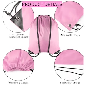 May include: A light pink drawstring backpack featuring black cords and black PU leather reinforced corners. The product details include adjustable length, a drawstring closure, and substantial strings. The bag has a smooth, solid-colored fabric construction with a central main compartment.