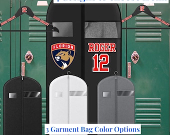 May include: A black garment bag featuring the Florida Panthers logo, the name ROGER, and the number 12 in red and white. The image includes two black hangers with the number 12 and the text ROGER CONANT, plus three garment bags in black, white, and gray.