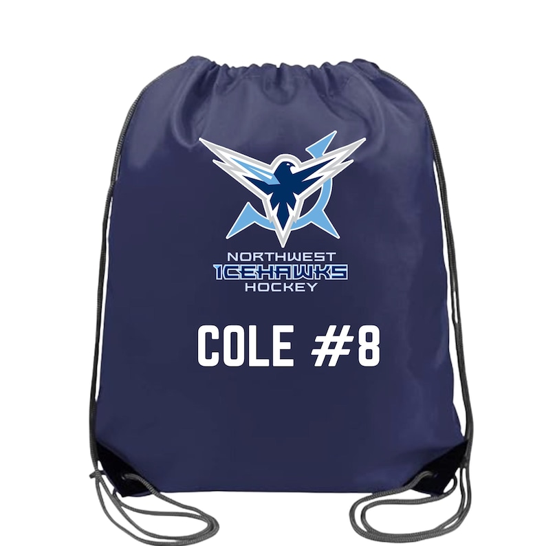 May include: A navy blue drawstring bag featuring a white and light blue graphic of a hawk logo above the text NORTHWEST ICEHAWKS HOCKEY. Below the logo, the name COLE and the number #8 are printed in bold white capital letters.