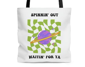 May include: White tote bag with black handles featuring a planet graphic with a purple planet, gold rings, and green and white checkered background. The text "SPINNIN' OUT" and "WAITIN' FOR YA" are printed on the bag.