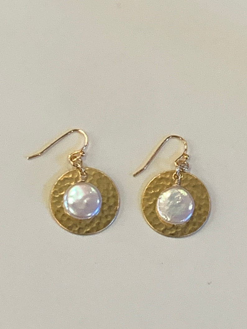 Solid hammered brass disc earrings with freshwater coin pearls.