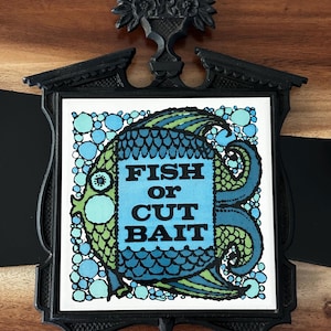 Large 11&quot; Ornate Cast Iron and Ceramic Trivet. Fish or Cut Bait Kitchen Decor
