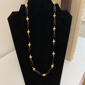 Vintage 1970s Gold metal beads and Black plastic beads signed Napier Necklace