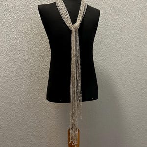 Collar vintage Art Déco con cuentas de semillas y borlas (147 cm de largo)