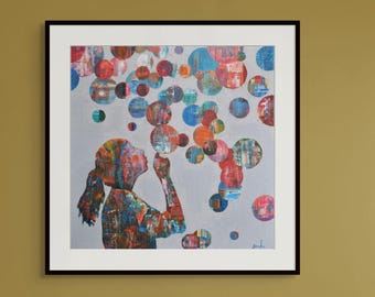 May include: Abstract art print of a girl blowing bubbles. The artwork features a silhouette of a girl in colorful hues, blowing multi-colored bubbles against a gray background. The piece is framed in a black frame.