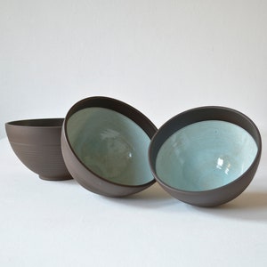 Fruit bowls, dark, glazed turquoise on the inside