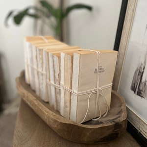 Neutral books for decorating, stacked books, neutral bookshelf decor, book decor, decorative books, book stack, wedding table decor, rustic