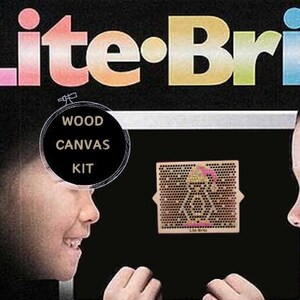 May include: A Lite-Brite box with a rainbow colored logo. The box features a close-up of two children looking at a Lite-Brite peg board. The box also says "Wood Canvas Kit".