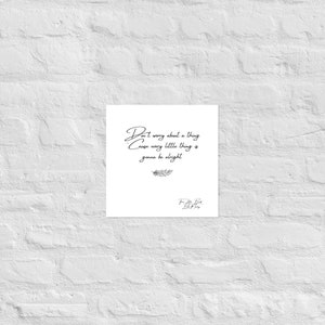 May include: A white square print with the handwritten text "Don't worry about a thing Cause every little thing is gonna be alright." A small feather illustration is below the text, and a signature is at the bottom.