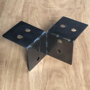 May include: Black metal corner brace with multiple holes for attaching to wood or other materials.