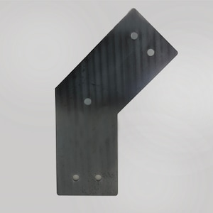 May include: A black metal corner brace with four holes for attaching to a surface. The brace is angled at 90 degrees.