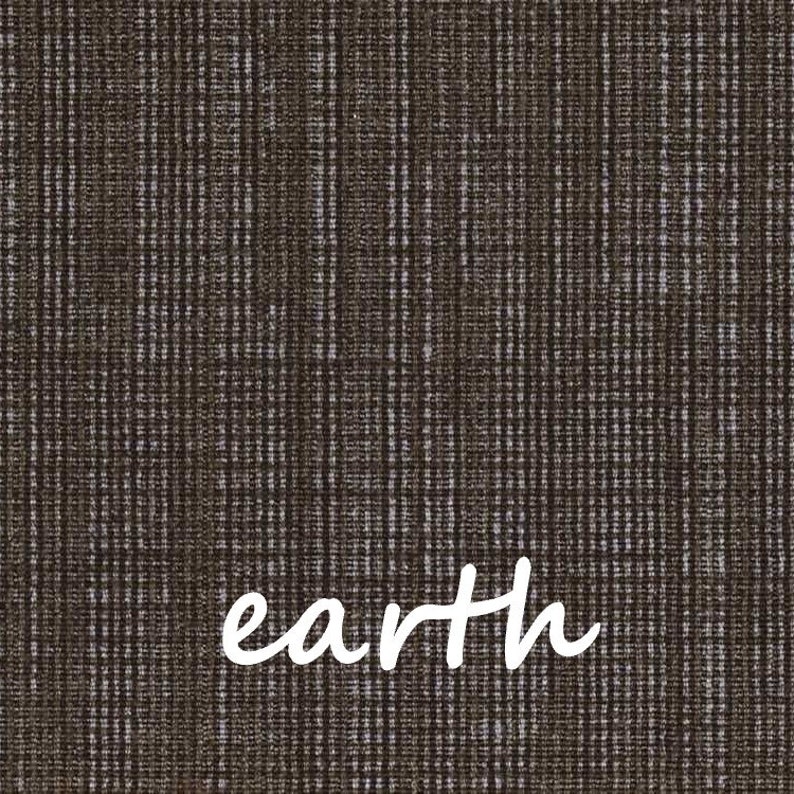 May include: Close-up of a brown fabric with a textured, vertical striped pattern. The word "earth" is written in white cursive across the bottom of the image. The fabric has a woven appearance.