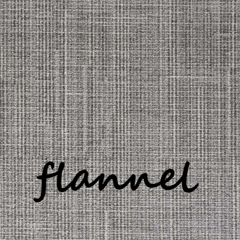May include: Close-up of gray flannel fabric with a textured weave. The word "flannel" is written in a cursive font across the bottom of the image. The fabric has a subtle, checkered pattern.