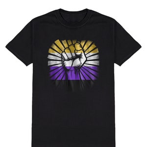 May include: Black t-shirt featuring a raised fist at the centre. The fist is surrounded by a purple, white and yellow striped flag with a sunburst design.