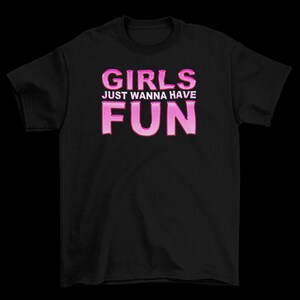 May include: Black t-shirt with pink text that reads "Girls Just Wanna Have Fun".