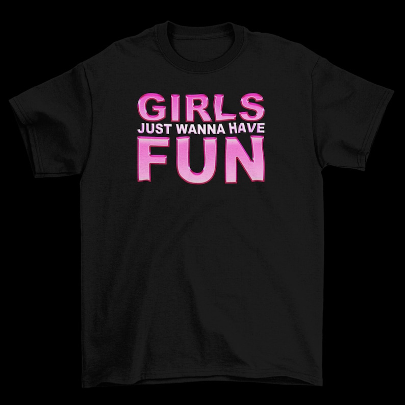 May include: Black t-shirt with pink text that reads "Girls Just Wanna Have Fun".
