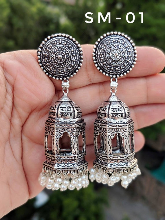 Jogan scripted German silver earring