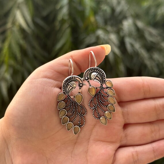 Peacock design earrings discount