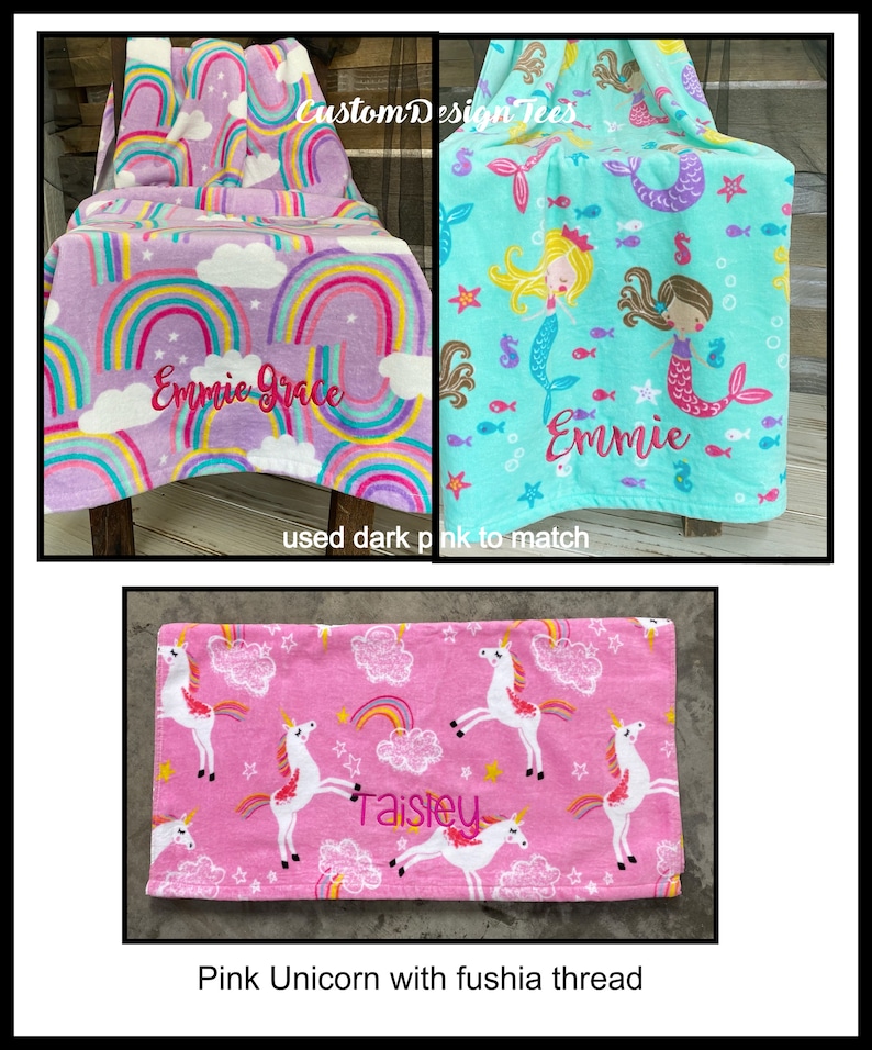 May include: Three fleece blankets with personalized embroidery. One is lavender with rainbows and the name "Emmie Grace". Another is turquoise with mermaids and the name "Emmie". The third is pink with unicorns and the name "Taisley".