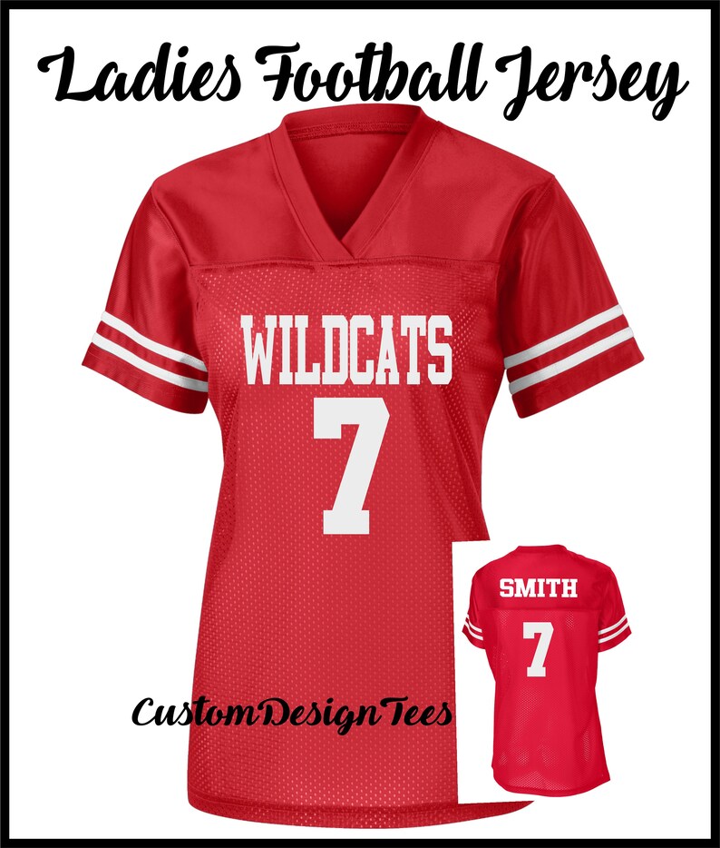 May include: A red V-neck football jersey with white stripes on the sleeves. The front features the text WILDCATS and the number 7 in white. A smaller inset shows the back of the jersey with the name SMITH and the number 7 in white lettering.