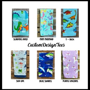 May include: Collection of colorful beach towels with various designs. Includes a turquoise towel with a surfing dinosaur, a mint green towel with mermaids, and a blue towel with dinosaurs. Other towels feature sea life, sharks, and unicorns. The text "CustomDesignTees" is also visible.