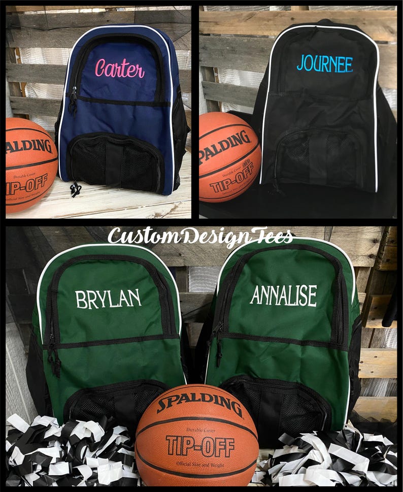 May include: Four personalized basketball backpacks with white trim. Two backpacks are green with white lettering, one is black with blue lettering, and one is blue with pink lettering. Each backpack has a mesh pocket on the front. A basketball with the Spalding logo is in front of the green backpacks.