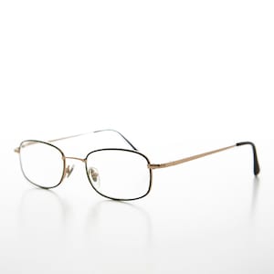 May include: Gold-tone metal eyeglasses with black rectangular frames and clear lenses.