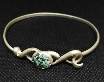 Delicate silver bangle with turquoise, elegant whirls and hook closure