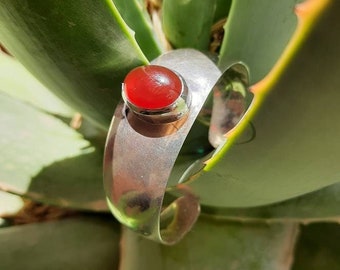 Chunky silver bangle with carnelian cabochon, adjustable and entirely hand made, ideal for summer