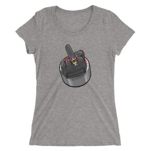 May include: A gray t-shirt with a cartoon image of a hand giving the middle finger. The hand is wearing a black glove and a ring with a skull on it.