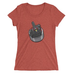 May include: Red, white, and blue graphic tee shirt with a cartoon image of a hand giving the middle finger. The hand is wearing a black glove and a ring with a skull on it.