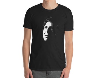 May include: A black t-shirt with a white silhouette of a person's face.