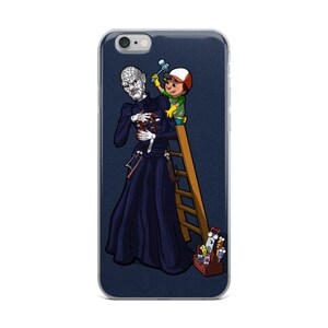 May include: A phone case with a cartoon illustration of a character from the movie "The Ring" being repaired by a small person on a ladder. The character is wearing a black dress and has long black hair. The small person is wearing a red hat and a green shirt. The ladder is made of wood and has a toolbox at the bottom.
