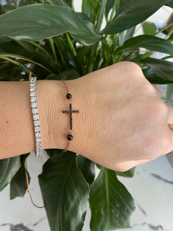 Mini Cross Bracelet with Sparkling Cubic Zirconia Rhodium on Silver Adjustable Length Mini Cross Bracelet with Sparkling Cubic Zirconia Rhodium on Silver Adjustable Length