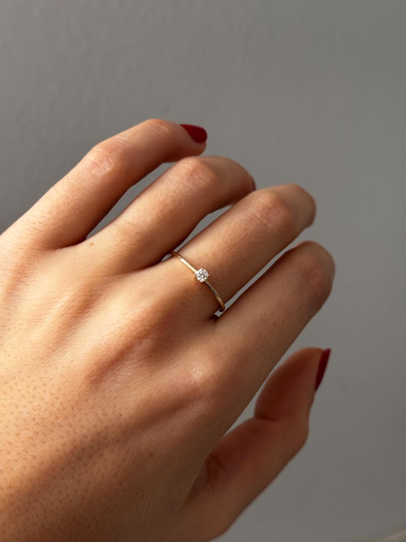 A beautiful, classic ring. Its "minimalist" and "dainty" aesthetic is incredibly popular on Etsy right now, especially for promise rings, stackable bands, and understated engagement rings.