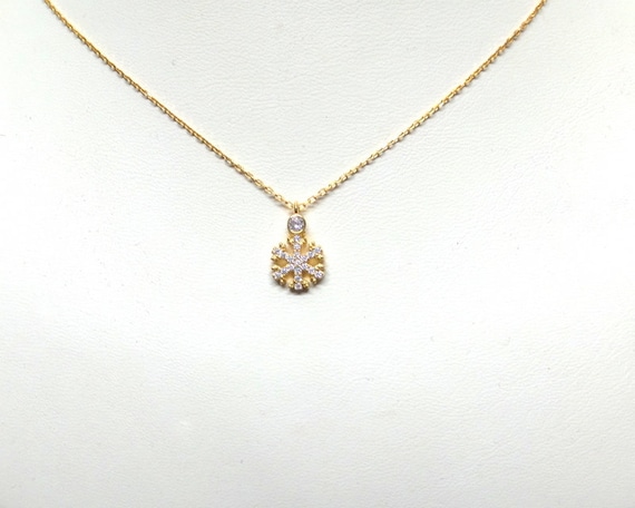 Cubic Zirconia Snowflake Necklace: Yellow Gold Plated Sterling Silver