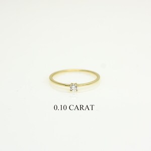 14k solid gold ring with a 4 prong set 0.10 carat 3 mm diamond .perfect as an everyday and stacking options, minimalistic promise ring displayed on a white background