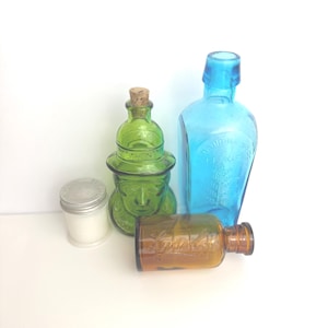 Groupe de 4 bouteilles en verre vintage - Lysol, Musterole, Wheaton, Straubmollers