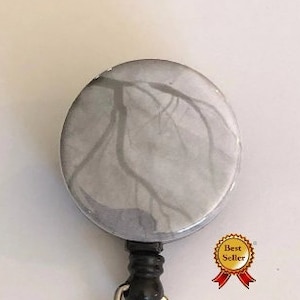 Stenosis cardiac cath retractable badge reel ER golden hour arteriogram image stent widow maker main blockage CT fluoroscopy cardiology