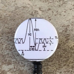 May include: A white badge reel with a black retractable cord and a round, white badge featuring a black and white line graph with the labels "FEV1", "VC", "ERV", "RV", "TL", and "1 SEC".