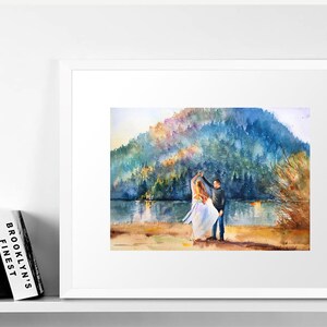 May include: A watercolor painting of a couple dancing in front of a lake and a mountain range. The couple is wearing casual clothing and the woman is wearing a white dress. The painting has a soft, romantic feel.