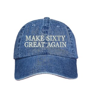 May include: A blue denim baseball cap with white embroidered text that reads "MAKE SIXTY GREAT AGAIN".