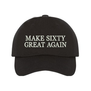 May include: Black baseball cap with white embroidered text that reads "MAKE SIXTY GREAT AGAIN".