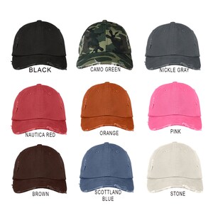 May include: Nine distressed baseball caps in various colors, including black, camo green, nickle gray, nautica red, orange, pink, brown, scotland blue, and stone.