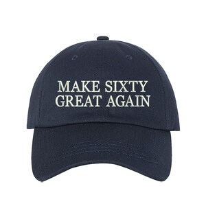 May include: A navy blue baseball cap with white embroidered text that reads "MAKE SIXTY GREAT AGAIN".