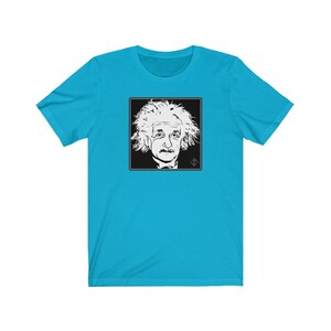 May include: A turquoise blue t-shirt with a black and white image of Albert Einstein's face in a square frame.