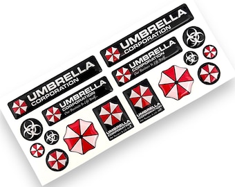 Pode incluir: Uma folha de adesivos em preto e branco com o logotipo da Umbrella Corporation. Os adesivos incluem o nome da empresa, um símbolo de guarda-chuva vermelho e branco e símbolos de perigo biológico. Os adesivos são brilhantes e têm um efeito 3D em relevo.