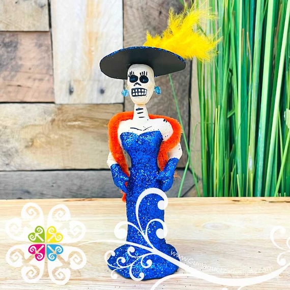 blue catrina dress Catrina with blue dress and pink flowers made of polychrome clay Tikal
