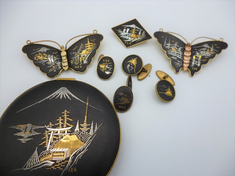 Vintage Amita Japan gold and silver inlay jewellery set comprising three brooches compact powder and two pair of cufflinks